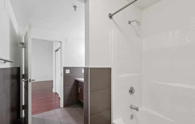 A white bathroom with a bathtub and shower.