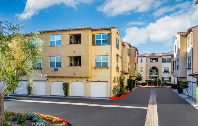 a row of apartments with white doors and a red carpet