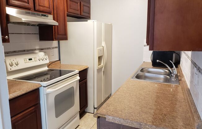 2 BR / 2 BA Condo with Attached Garage and Yard