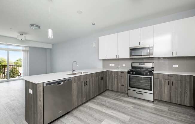a kitchen with wooden cabinets and stainless steel appliances