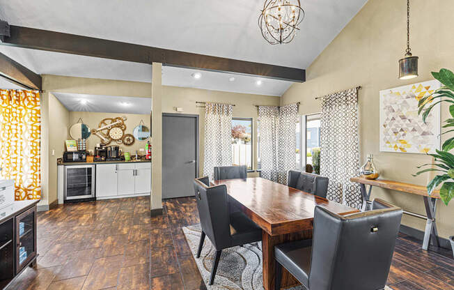 A dining room with a wooden table and chairs.