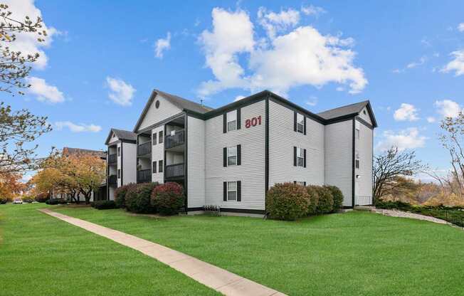 Apartment building number 801 with a green lawn in front.