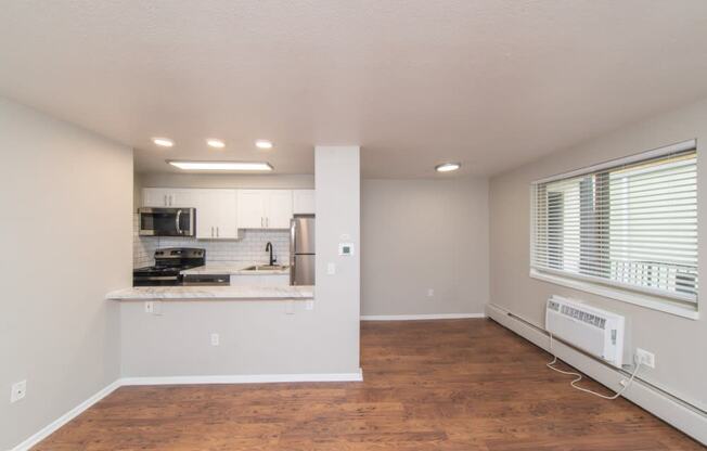 Open living area with beautiful wood flooring