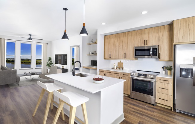 Luxuriate in unparalleled elegance at Modera Riverview with single-basin sinks, stylish tile backsplash, and ENERGY STAR® stainless steel appliances.