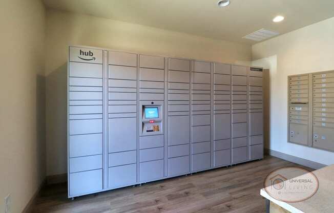 a large set of lockers in a room with a wood floor