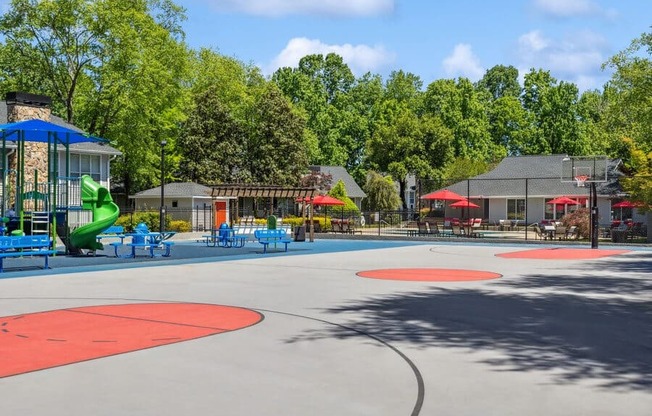Community Sports Court and Playground Area at Dunwoody Village Apartments in Atlanta, GA.