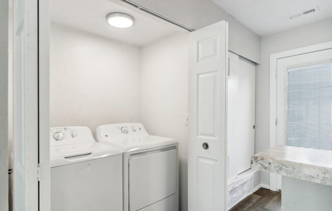 a laundry room with a washer and dryer