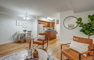 an open living room with a dining room and a kitchen