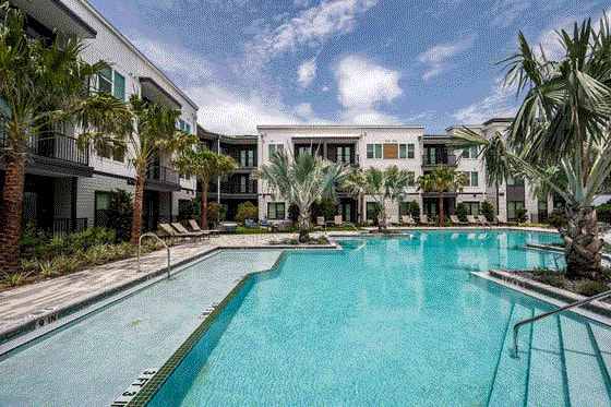 Vibrant poolside lounge with chairs at The Citizen at Waterset in Apollo Beach, FL