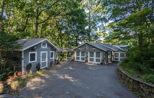 Unique Lake Lanier front home w/spectacular natural rock waterfall and dock