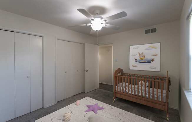 This is a photo of a virtually staged second bedroom room in the 970 square foot 2 bedroom, 2 bath apartment at Preston Park Apartments in Dallas, TX