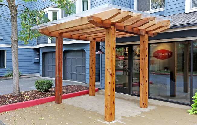 a patio with awning in front of a building