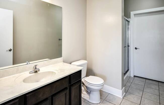 a bathroom with a sink toilet and a shower