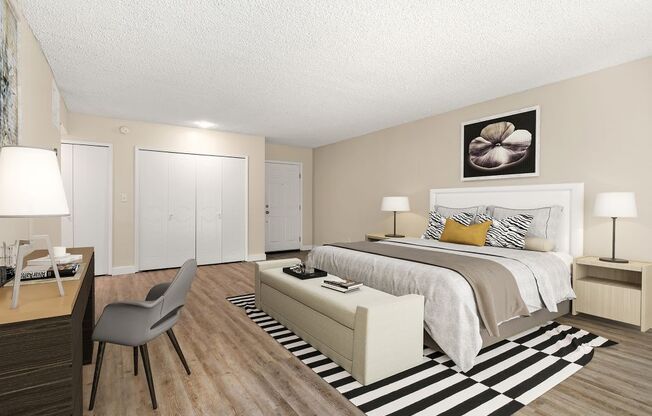 a bedroom with a bed and a desk