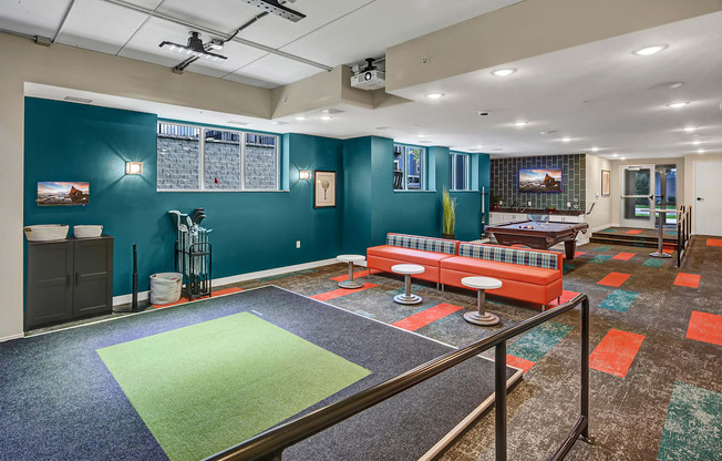 a game room with a ping pong table and a couch