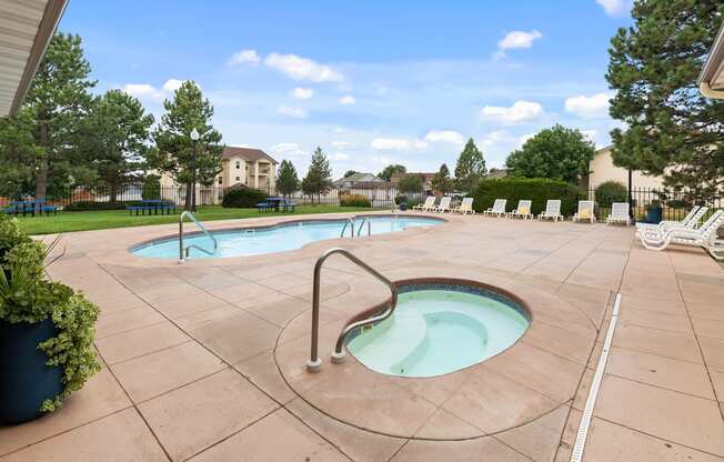 our apartments have a resort style pool and spa with chaise lounge chairs