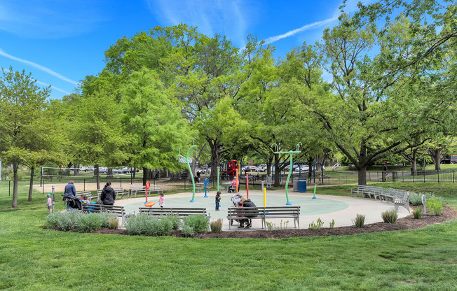 a playground in a park with people playing on it