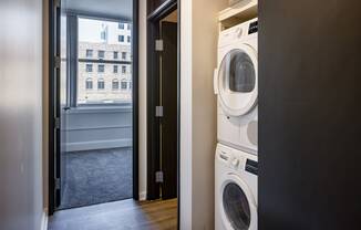 a washer and dryer in a laundry room with a window