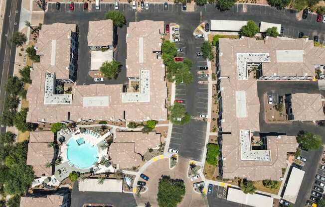 arial view of an apartment complex with a swimming pool