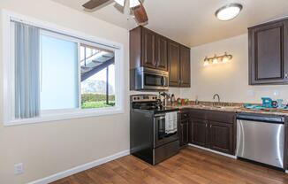 a kitchen with a sink and a window