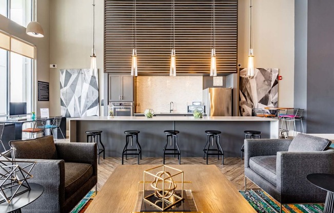 a living room with a kitchen and a table with chairs