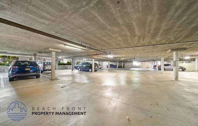 an empty parking garage with cars in it