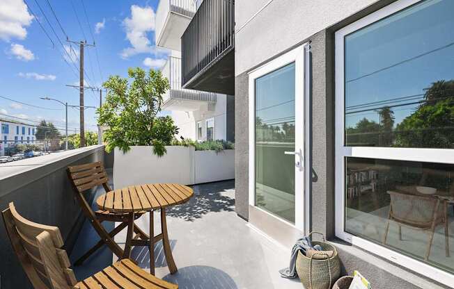 A patio with a table and chairs is shown.
