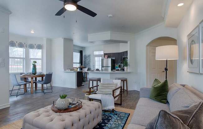 A living room with a grey couch and a coffee table.