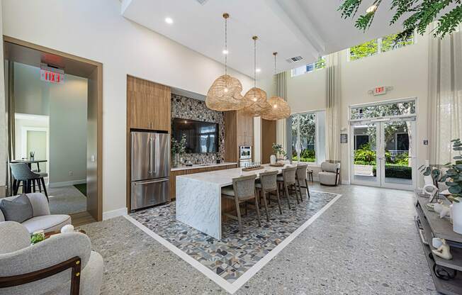 a large kitchen with a large island and a dining room table