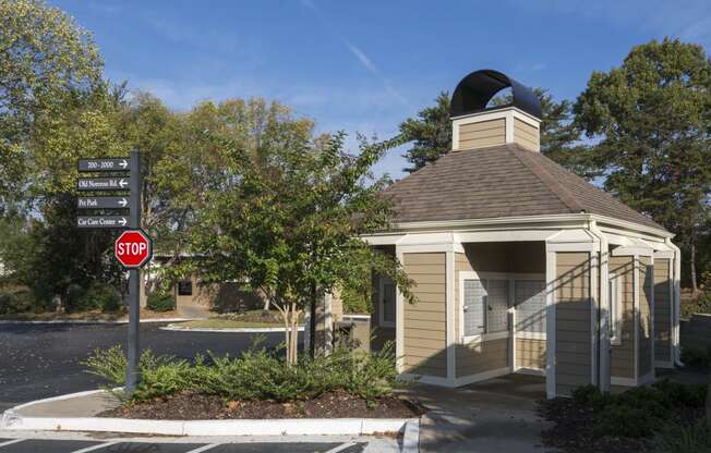 a small building with a stop sign in front of it