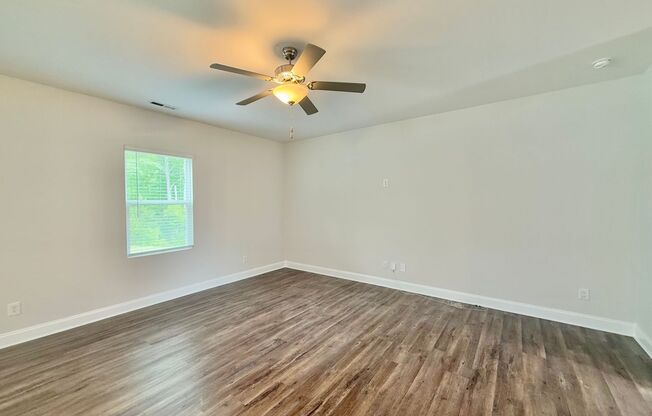 Modern 3BD, 2.5BA Raleigh Home in a Great Location with a Covered Patio and Private Backyard