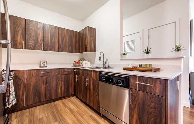 Kitchen showing dishwasher and sink