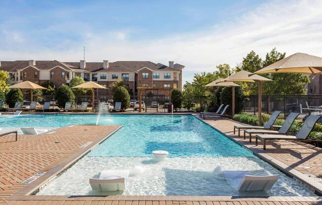 Refreshing salt water swimming pool with sundeck at Avenues at Craig Ranch apartments for rent in Dallas
