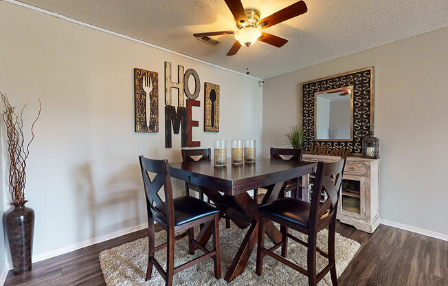 a dining room with a table and chairs