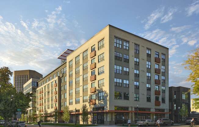 a rendering of a new apartment building on a city street at The Lucy Boise Apartments, Boise
