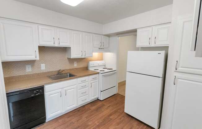 This is a photo of the kitchen in the 751 square foot 1 bedroom, 1 bath apartment at Woodbridge Apartments in Dallas, TX.