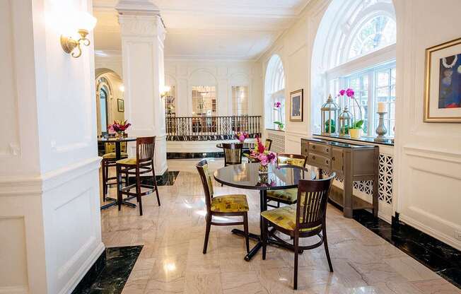 dining area with dark tables and green dining chairs at Residences at Forest Park, Missouri