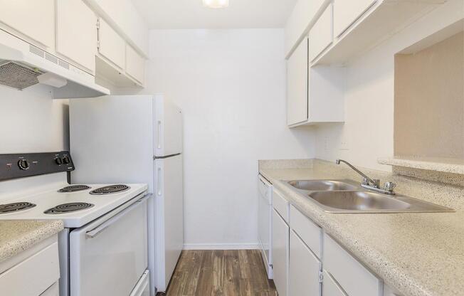 a kitchen with a stove and a sink