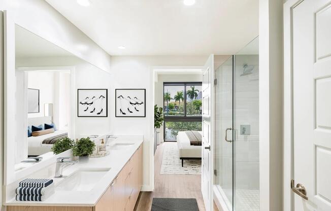 Spa-inspired bathrooms at Modera Aventura feature dual vanities and glass-enclosed showers in select homes for a refined touch.