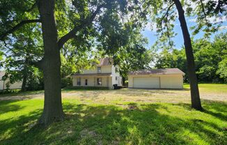 Nice home with oversized 2car gar with work bench and large shaded yard. Country-like setting