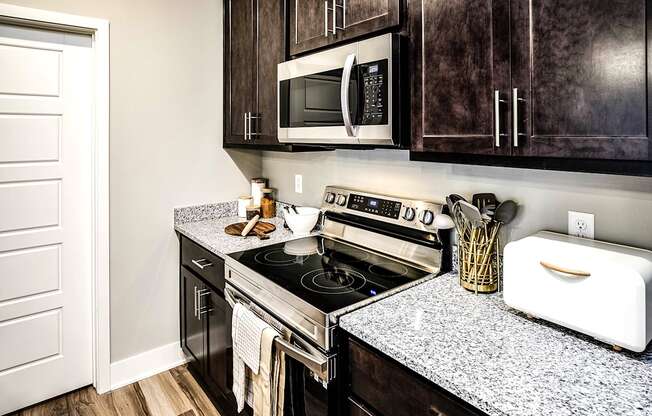 Kitchen with stainless steel appliances at Sterling Prairie Trail North in Ankeny, IA