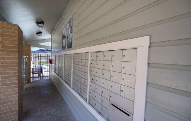 a row of mailboxes on the side of a building