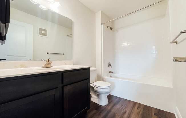 an empty bathroom with a toilet and a sink