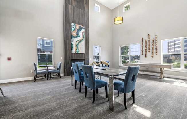 A conference room with a long table and chairs.