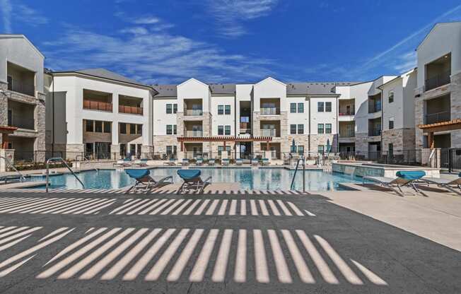 Poolside Sundeck With Relaxing Chairs at McCarty Commons, San Marcos, TX