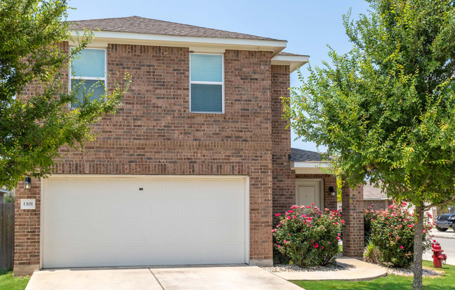 a house with a white garage door