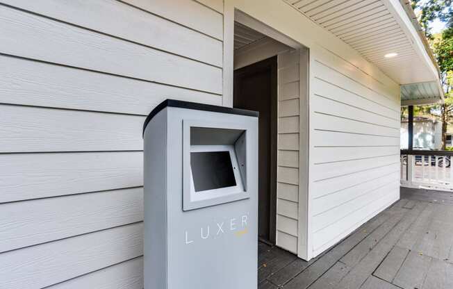 a mailbox on the side of a house next to a door