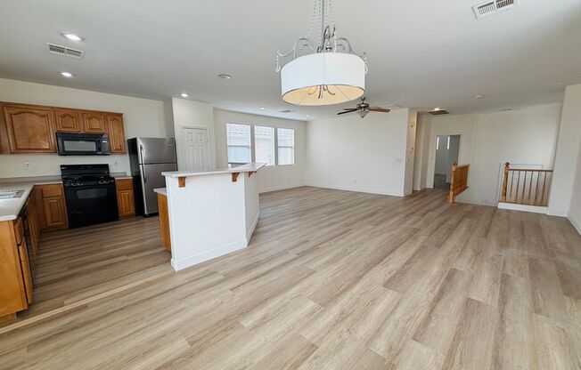 4 bed 2.5 bath home in the southwest with 3 bedrooms downstairs and the master bedroom upstairs! New LVP flooring installed throughout the house!
