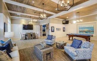 a living room filled with furniture and a pool table  at Palm Bay Club, Florida, 32258
