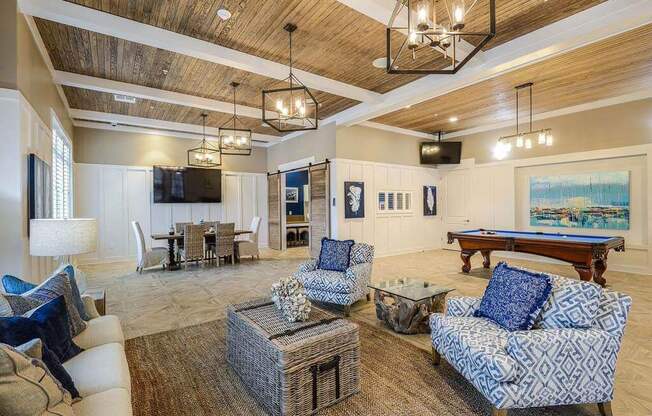 a living room filled with furniture and a pool table  at Palm Bay Club, Florida, 32258